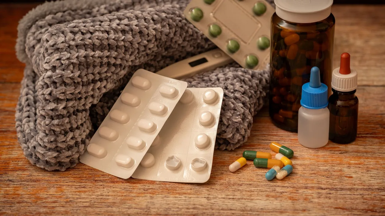 Warm indoor setup with medicine, scarf, and thermometer, ideal for cold and flu remedies.