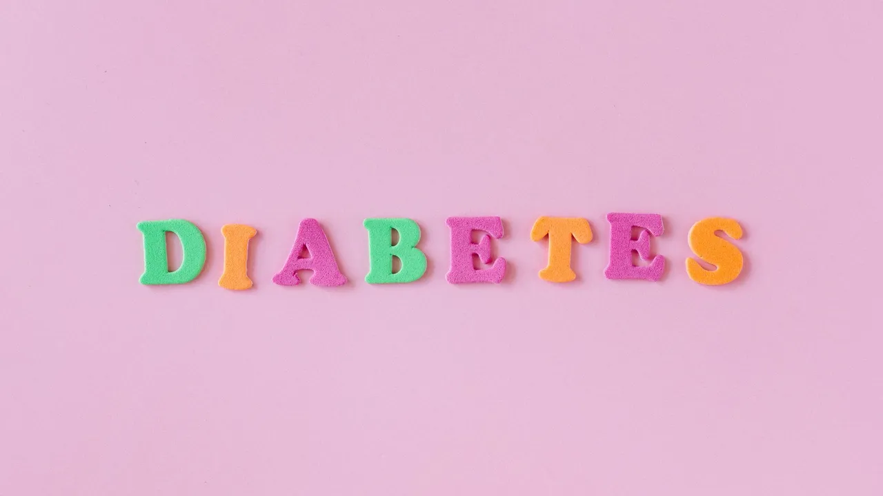 Colorful letters spelling 'diabetes' on a pink background, emphasizing health awareness.